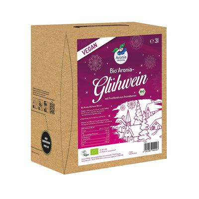 Organic aronia mulled wine Bag-in-Box on wooden stand, kraft brown box with magenta winter label and vegan badge.
